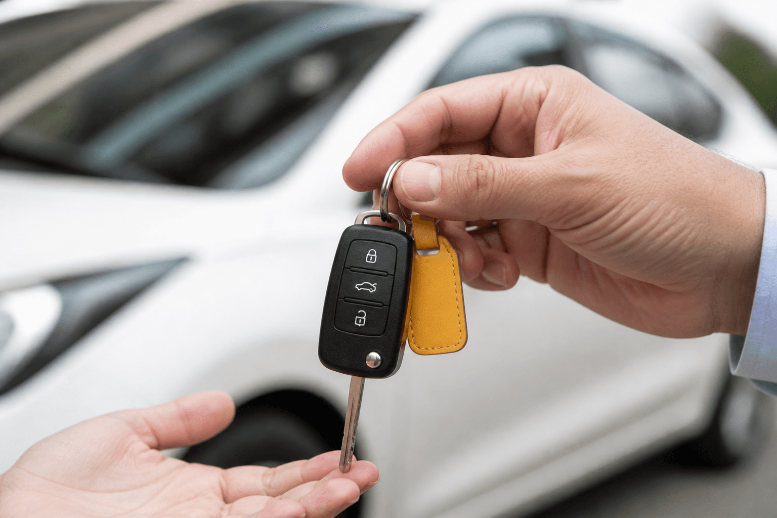 Hand holding car keys